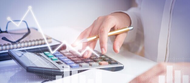 Accountant calculating profit with financial analysis graph