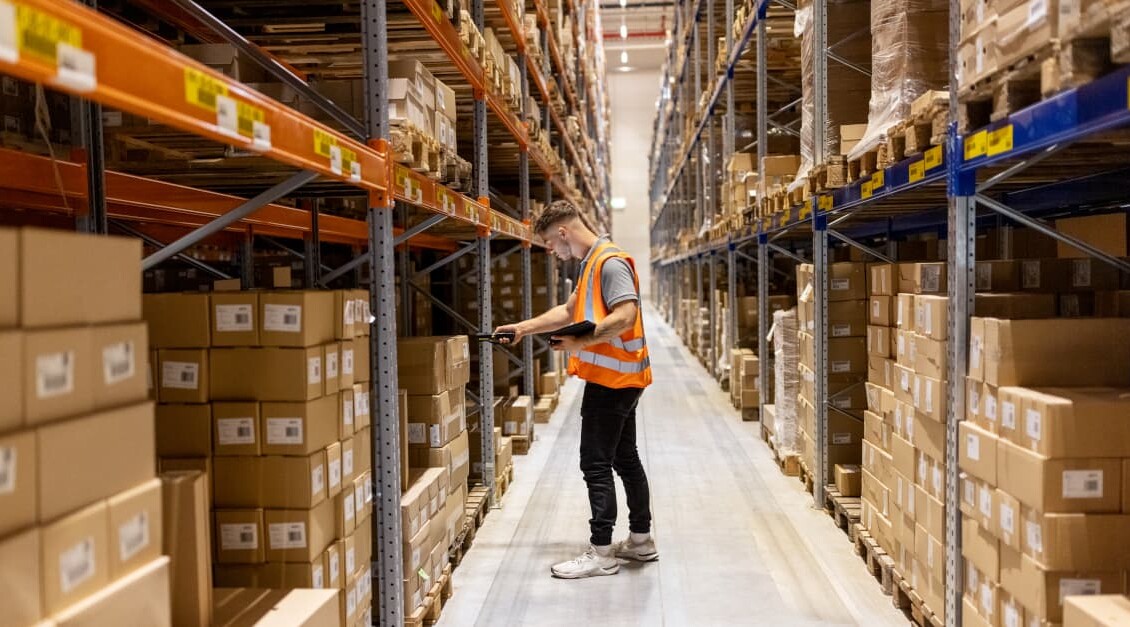 warehouse worker scanning package